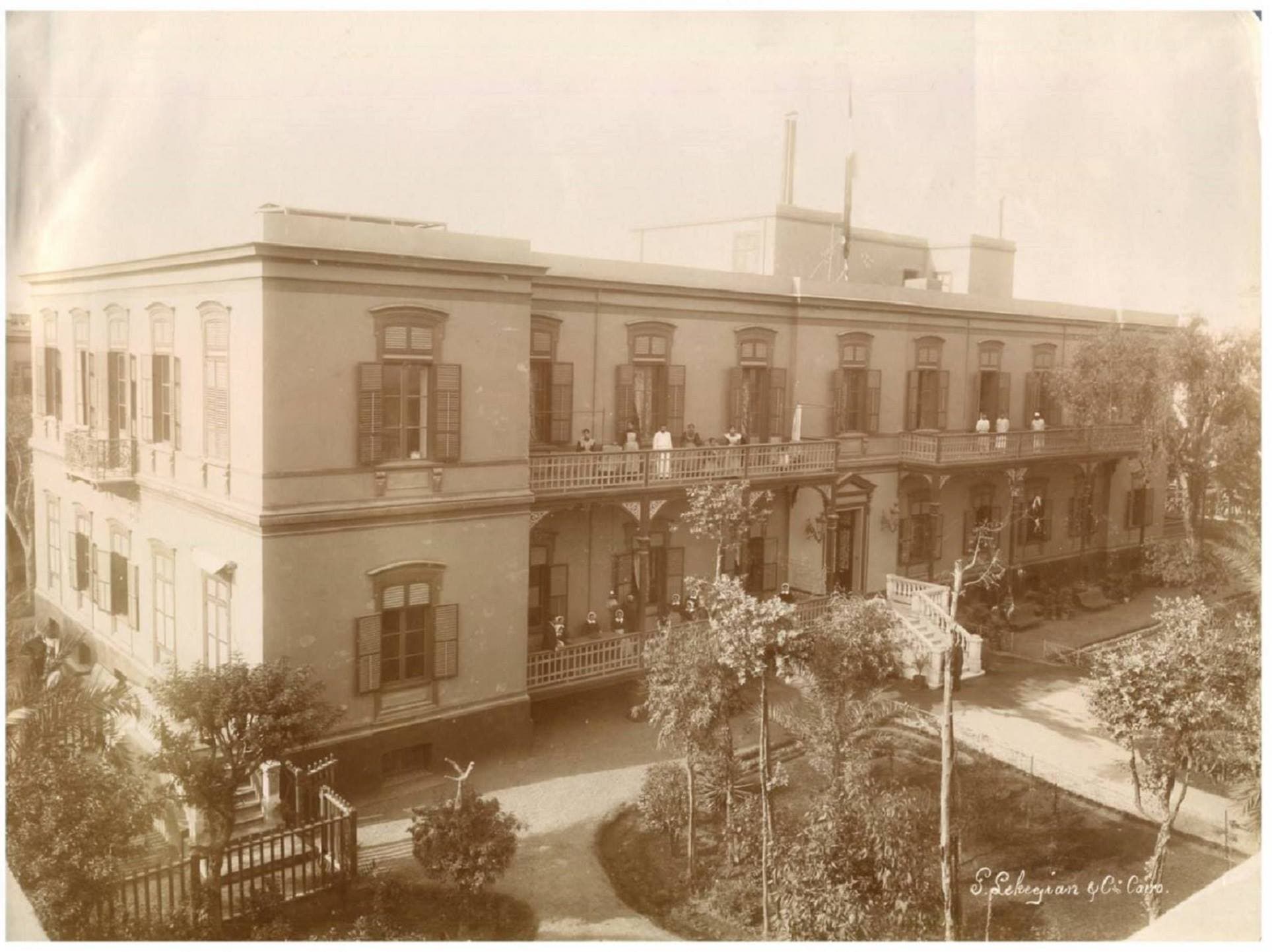 A historic photograph of the Grand Coptic Benevolent Society building.